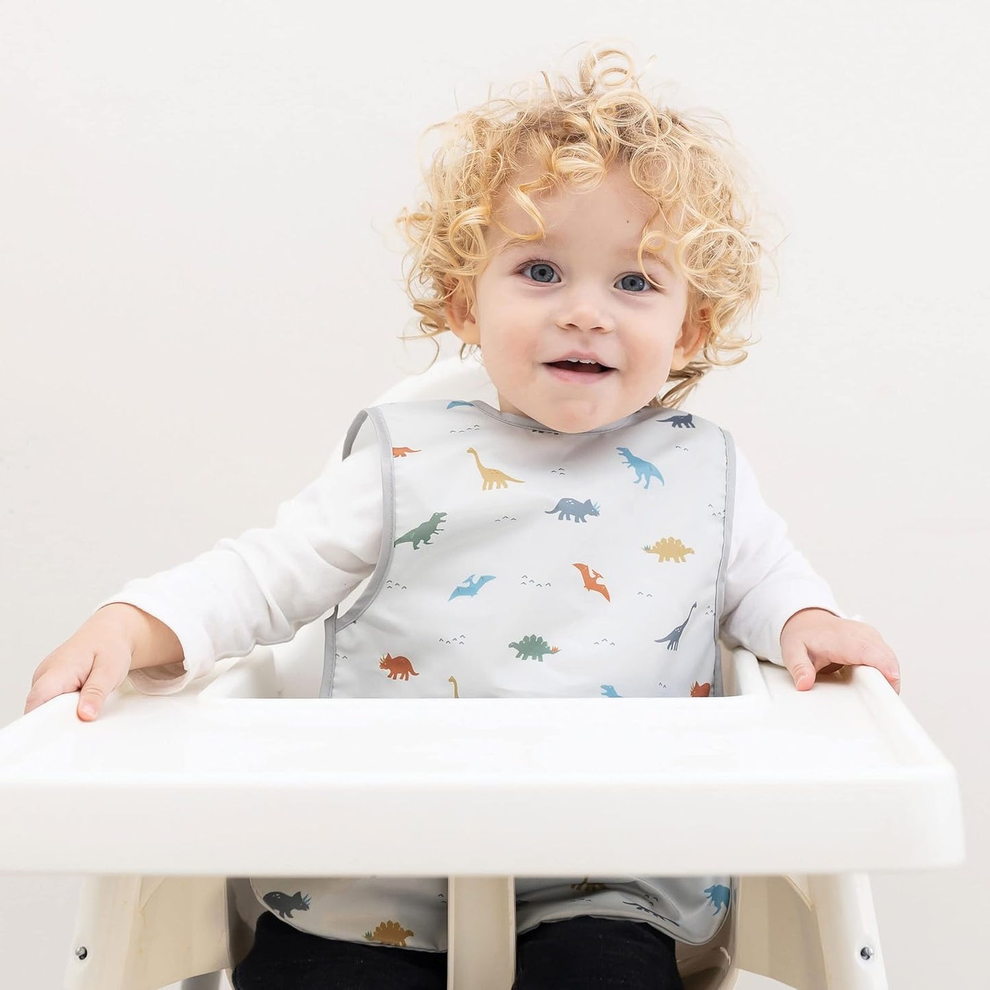 Tiny Twinkle Mess Proof Baby Bib - Waterproof & Lightweight Baby-Led Weaning Apron | 100% Recycled Polyester, Easy Clean & Machine Washable (Dinosaur, Small 6-24 Months)