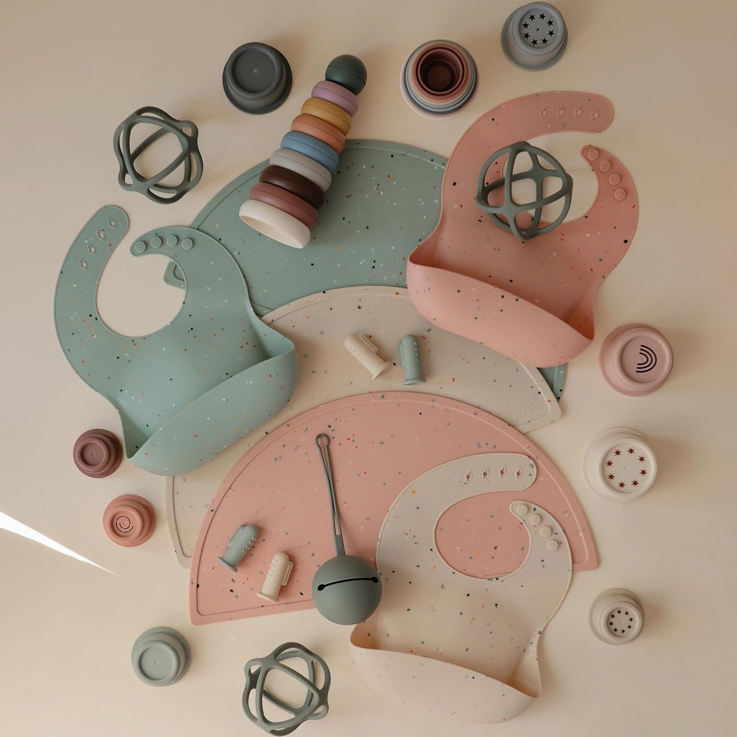 mushie Silicone Baby Bib | Adjustable Fit Waterproof Bibs (Powder Pink Confetti)